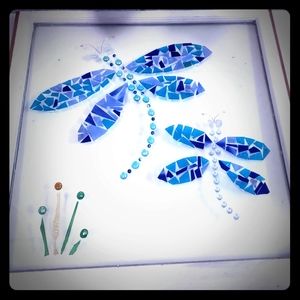 Dragonflies on clear window